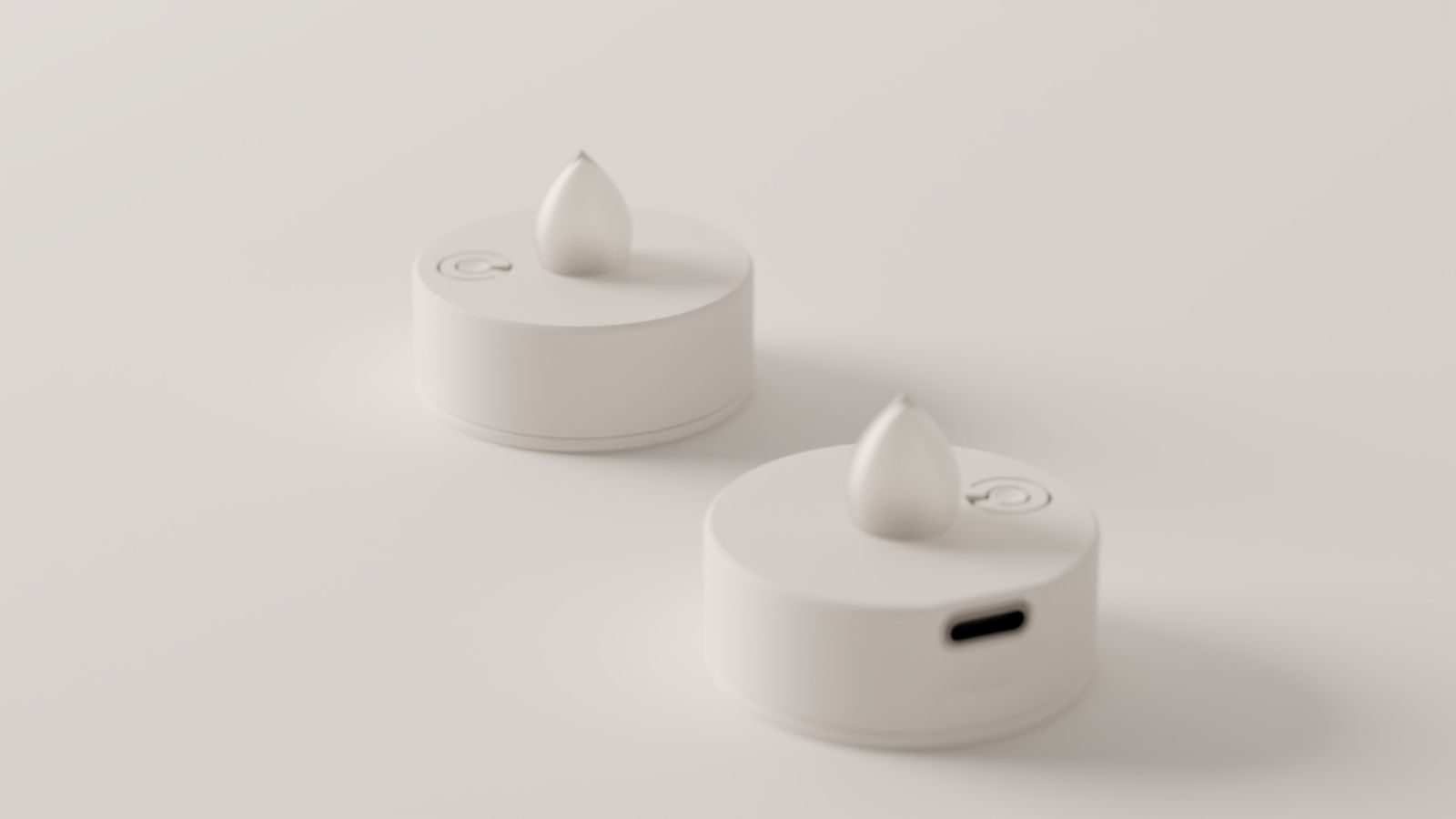 Two teelicht pro lights, switched off, on white paper in daylight. One shows its USB-C port.